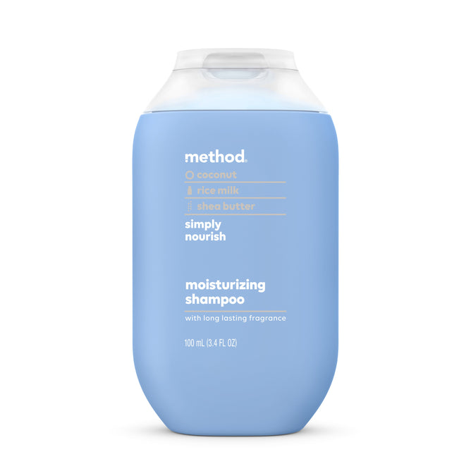 A 100 mL Method Shampoo - Travel Size in a blue bottle with a translucent flip cap features coconut, rice milk, and shea butter. It reads simply nourish and with long-lasting fragrance. Made from recycled plastic with cruelty-free ingredients, offering a sustainable touch.