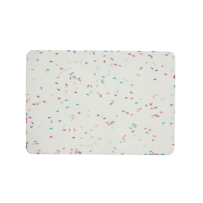 The GIR Silicone Baking Mat features a white background with multicolored, scattered sprinkles in blue, red, orange, and green. This eco-friendly kitchen essential combines style with sustainability for your daily cooking needs.