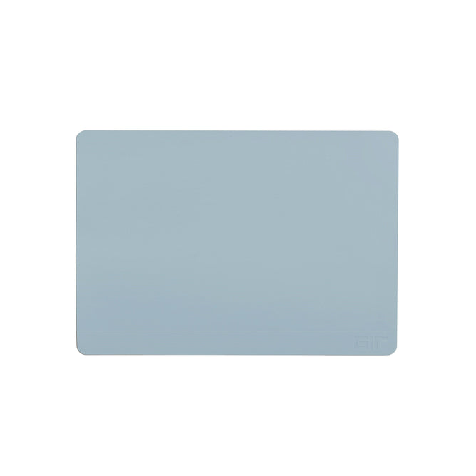 The GIR Baking Mat is a light blue, rectangular silicone mat with rounded corners. Its eco-friendly, plain, and reusable, featuring a discreet logo in the bottom right corner.
