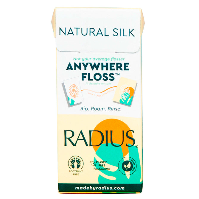 The image displays a box of Radius Anywhere Floss™ Sachets, emphasizing its Natural Silk material and eco-friendly flossers in plastic-free packaging. The design includes green, orange, and beige tones with the Radius logo prominently at the bottom.