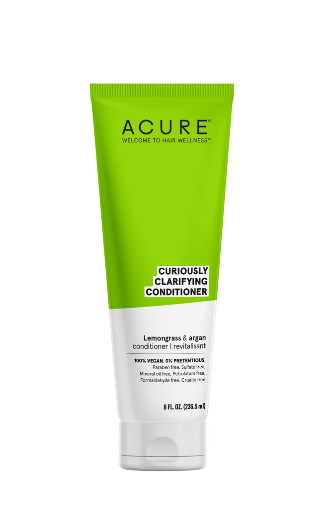An 8 fl oz tube of Acure Curiously Clarifying Conditioner with lemongrass and argan oil, boasting a vegan, sulfate-free, paraben-free, cruelty-free formula in eco-friendly green and white packaging.