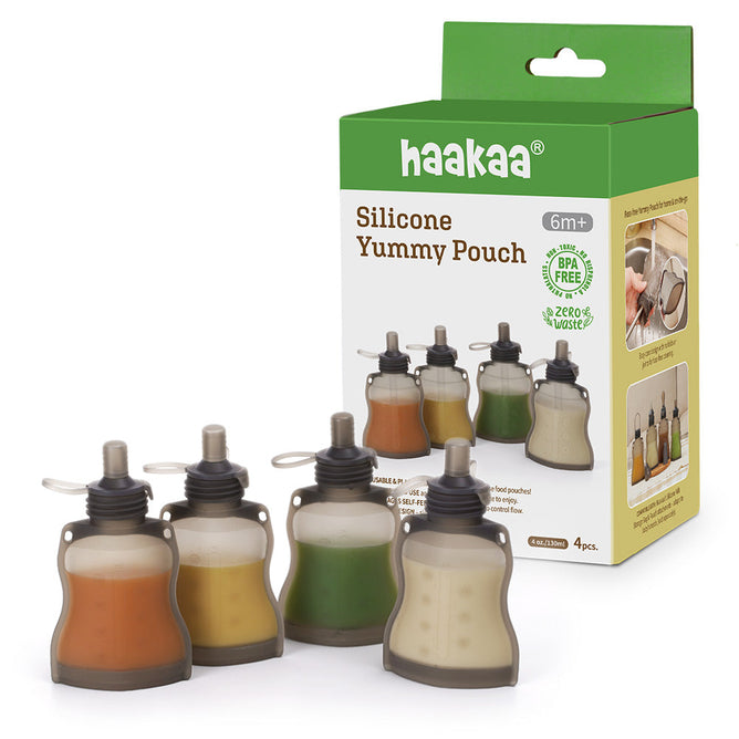 The Haakaa packaging displays a set of four Reusable 100% Food Grade Silicone Baby Food Pouches in vibrant, planet-friendly designs. They are BPA-free and ideal for ages 6 months and up, supporting your little ones self-feeding journey.