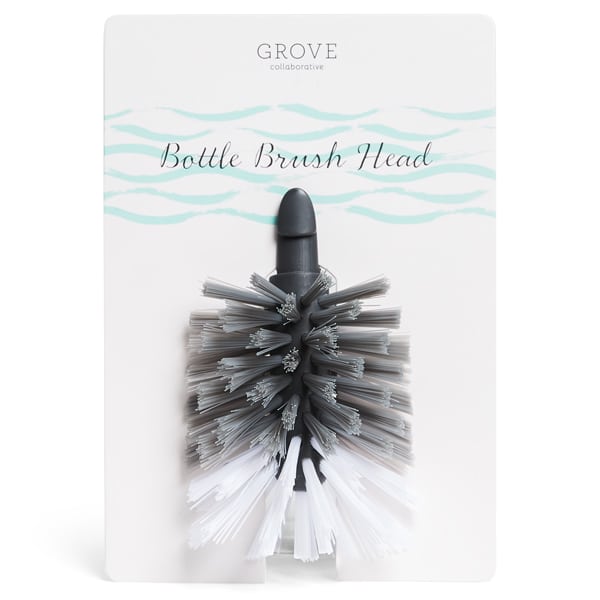 The Grove Co. Bottle Brush Replacement Head, ideal for cleaning water and baby bottles, is gray and white, attached to a white card labeled Grove Co. Bottle Brush Replacement Head with a stylish blue wave design at the top.