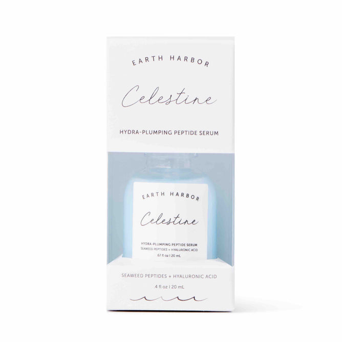 A white box labeled Earth Harbor CELESTINE Hydra-Peptide Replenishing Serum contains a small blue bottle featuring seaweed peptides and hyaluronic acid. Experience celestial radiance with this vegan, cruelty-free serum through its front cutout.