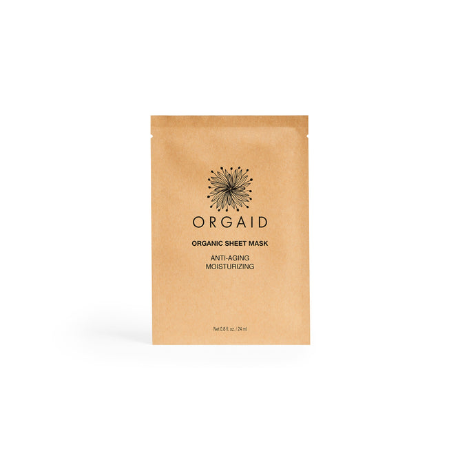 A brown ORGAID package of the Anti-Aging & Moisturizing Organic Sheet Mask features Anti-Aging Moisturizing text on the front, complemented by a stylish black sunburst logo.