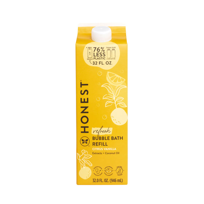 A yellow carton of The Honest Companys Bubble Bath Carton Refill with a citrus vanilla scent features citrus fruit illustrations and uses 76% less plastic. Infused with nourishing coconut oil, this tear-free formula holds 32 fl oz (946 ml).