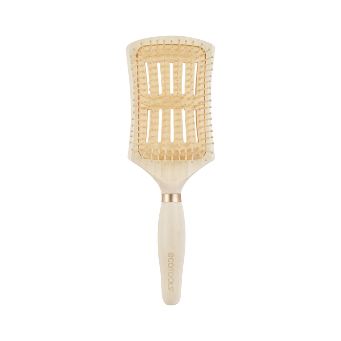 The EcoTools Eco Smoothing Brush features a wide, rectangular paddle with spaced bristles, a light wood tone, and a curved bamboo handle for easy grip. Its design serves as both a smoothing detangler and an eco-friendly addition to hair care.