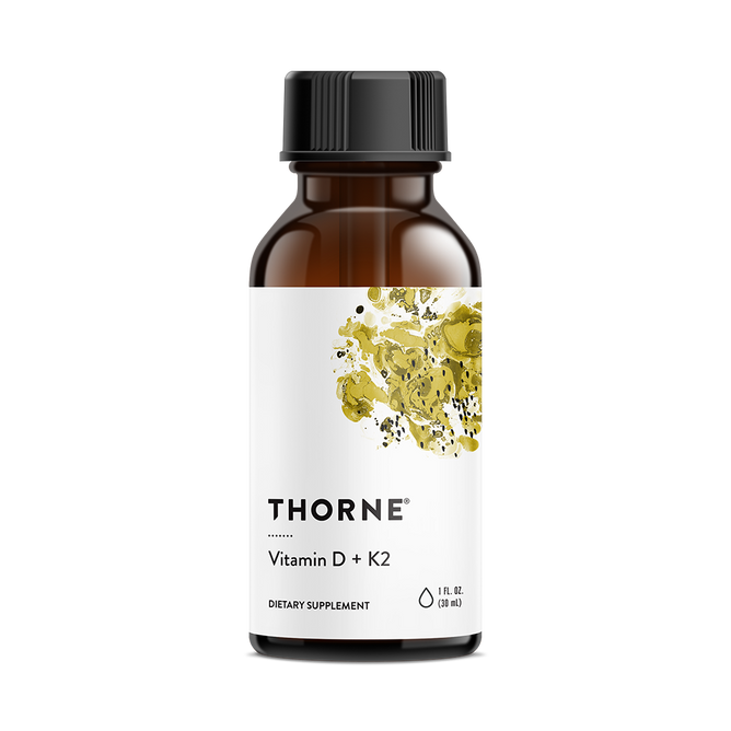 A brown glass bottle labeled with the brand name Thorne and product name Vitamin D + K2 features a white label with abstract yellow and black artwork. This 1 fl oz (30 ml) dietary supplement is formulated for immune support, combining vitamins D and K to enhance wellness.