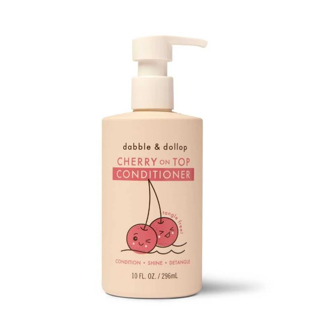 Dabble & Dollops Cherry On Top Conditioner is ideal for all hair types. The 10 fl. oz. (296 mL) bottle has a delightful label with two smiling cherries and offers deep hydration along with conditioning, shine, and detangling benefits.