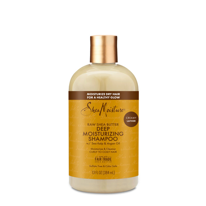 A 13 fl oz (384 ml) bottle of SheaMoistures Raw Shea Butter Moisture Retention Shampoo features a yellow label with brown text. Infused with raw shea butter, sea kelp, and argan oil, this sulfate-free shampoo offers a creamy lather and is ideal for curly to coily hair.