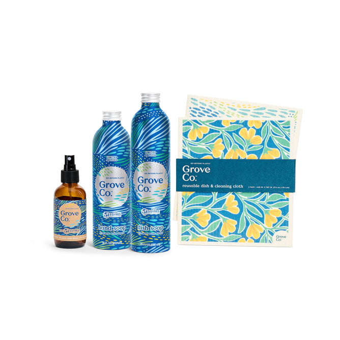 Discover Grove Collaboratives limited edition Kitchen Essentials Set - Spring Collection, featuring Atlantic Dune Grass-inspired blue bottles and yellow floral patterned cloths. This set includes hand soap, dish soap, a spray bottle, and a reusable cleaning cloth set.