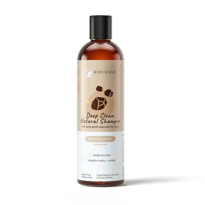 A 12 fl oz bottle of vet-formulated kin+kind Deep Clean Shampoo for dogs features activated charcoal and almond+vanilla essential oils, promising odor control and enhanced coat brightness.