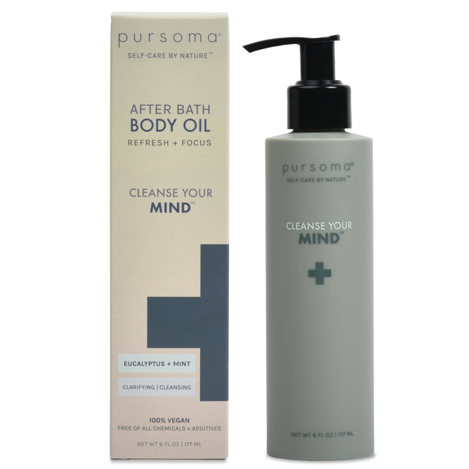 A bottle of Cleanse Your MIND Oil by Pursoma rests beside its packaging, radiating clean wellness. Featuring a calming eucalyptus and mint blend, its labeled Cleanse Your Mind and proudly states 100% Vegan and Free of All Chemicals + Additives.
