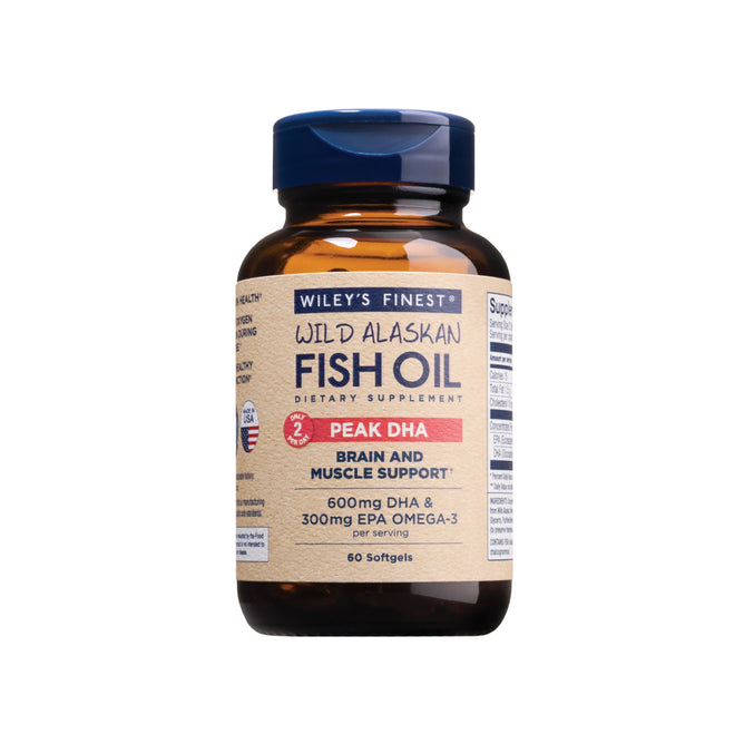 A bottle of Wileys Finest Wild Alaskan Fish Oil - Peak DHA supports brain health and muscle with 600mg DHA and 300mg EPA Omega-3 per serving, offering convenience in 60 softgels.