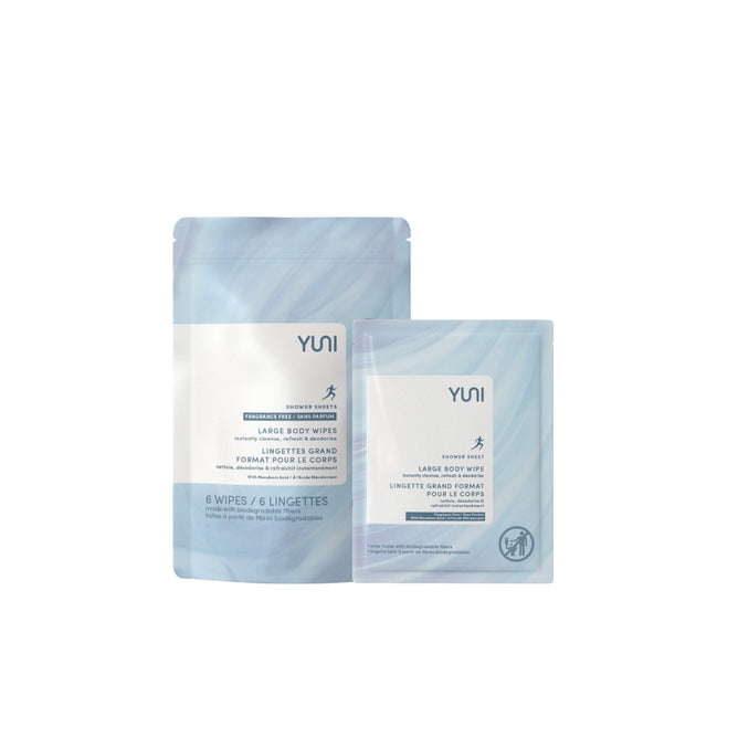 Two light blue YUNI Shower Sheets packages, one larger and one smaller, feature a minimalist design with a white label describing unscented wipes suitable for sensitive skin. Each package includes a small person icon.