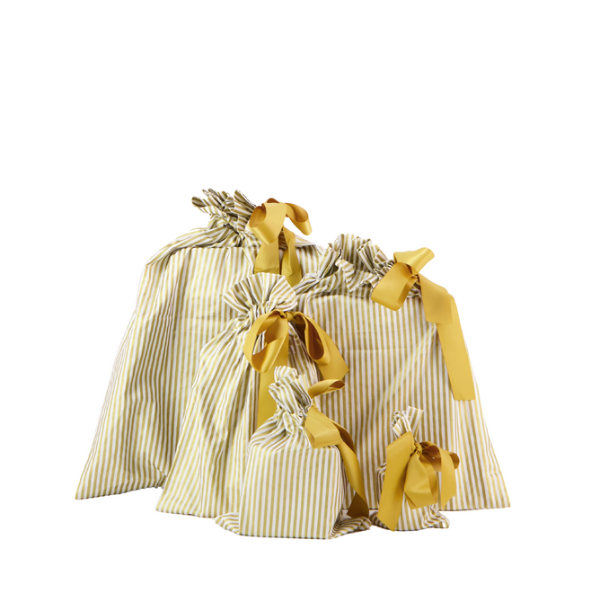 Five Reusable Gift Bags from Waste Free Celebrations, featuring yellow and white stripes and made from 100% cotton, are tied with large yellow bows and arranged staggeredly.