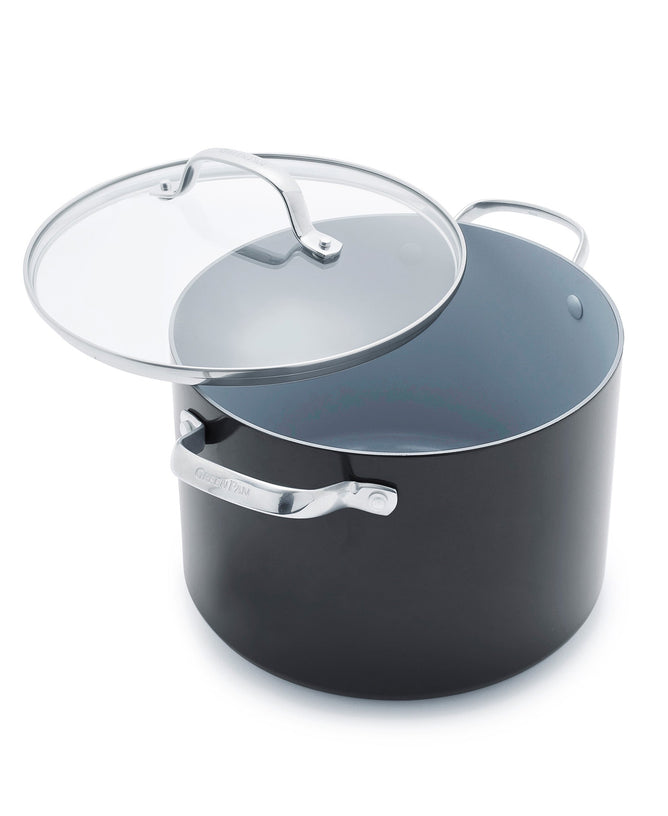 The GreenPan Valencia Pro Nonstick 8qt ceramic stockpot in black hard anodized aluminum features a silver handle and comes with a matching slightly tilted glass lid, also with a silver handle. Its interior gray finish ensures easy cooking and cleaning.