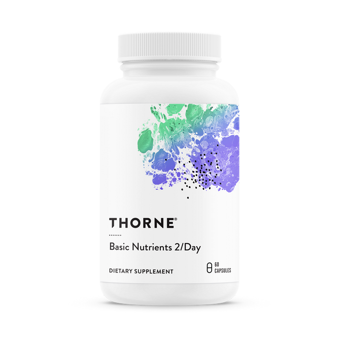 A white bottle of Thornes Basic Nutrients 2/Day daily multi, offering comprehensive nutritional support with 60 capsules, features a label with abstract splashes of green, blue, and purple paint.