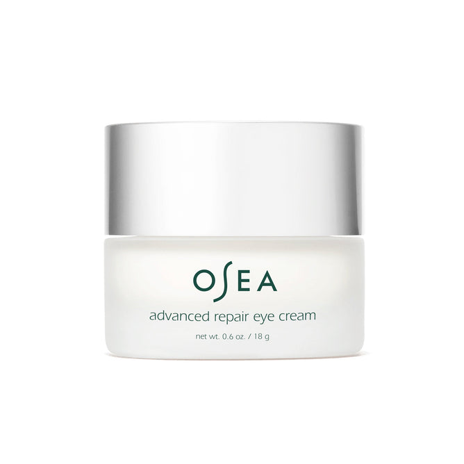 The OSEA Advanced Repair Eye Cream comes in a white jar with a metallic lid, containing 0.6 oz / 18 g of an anti-aging formula designed to reduce puffiness and rejuvenate the eyes.