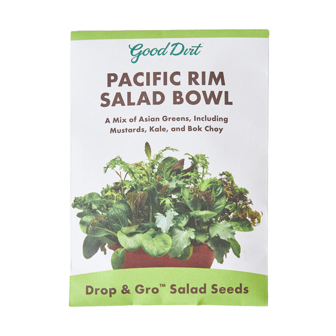 The Seed Pack Pacific Rim Mix by Good Dirt features Asian greens like mustards, kale, and bok choy. This white and green packet highlights the Non-GMO Drop & Gro™ Salad Seeds, ideal for quick gardening.