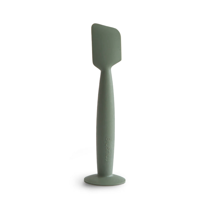 The mushie Diaper Cream Applicator features soft, BPA-free silicone and a sturdy handle with an embossed logo. Its flat, angled head ensures mess-free application—an essential addition to your baby care routine.