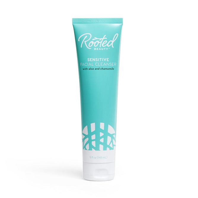 Rooted Beautys Sensitive Skin Facial Cleanser features R7 complex, aloe, and chamomile in a turquoise 5 fl oz (148 mL) tube with a white logo and abstract design. Its an eco-friendly choice in recyclable packaging.