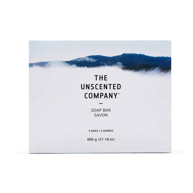 The Unscented Company Soap Bar box features a minimalist mountain and cloud design on a white background. It contains five vegan bars made from naturally derived ingredients, totaling 600g (21.16 oz).