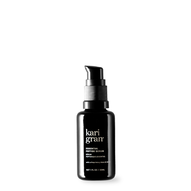 The black bottle of Kari Grans Essential Peptide Serum with Matrixyl 3000 has a pump dispenser and is set against a white background, showcasing its label with the brand, product name, peptides infusion, and size details.