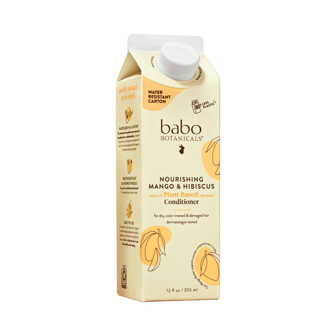 Babo Botanicals Nourishing Conditioner for Dry, Damaged Hair features water-resistant packaging with vibrant mangoes and hibiscus flowers. Enriched with mango butter, its designed for a sustainable routine for dry, color-treated hair.