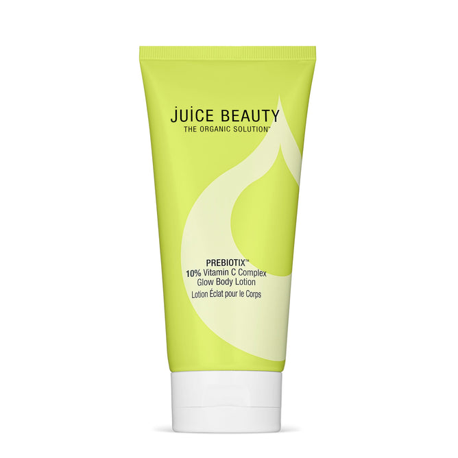 The lime green Prebiotix 10% Vitamin C Complex Glow Body Lotion by Juice Beauty, adorned with a white leaf design, promises an INSTANT GLOW and features organic, illuminating properties.