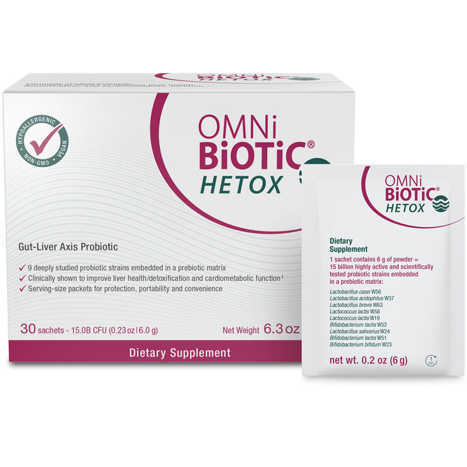 The OMNi-BiOTiC Hetox, a probiotic with 30 sachets, supports gut-liver health and detox, is gluten-free and non-GMO. The mostly white box with pink and green accents showcases the products benefits.