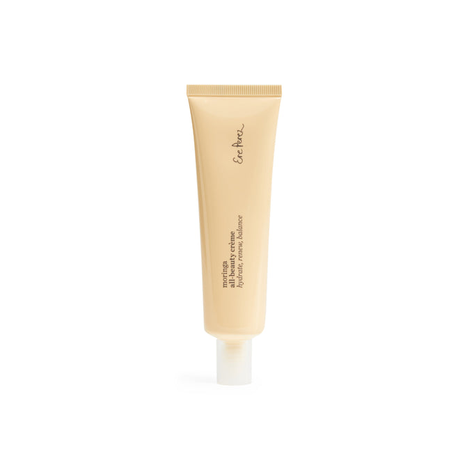 A beige tube with a white cap stands upright, featuring En Her, and denotes its the Moringa All-Beauty Crème, a mattifying emulsion by Ere Perez. The simple design highlights a clean aesthetic on a white background, making it ideal for any skincare routine.