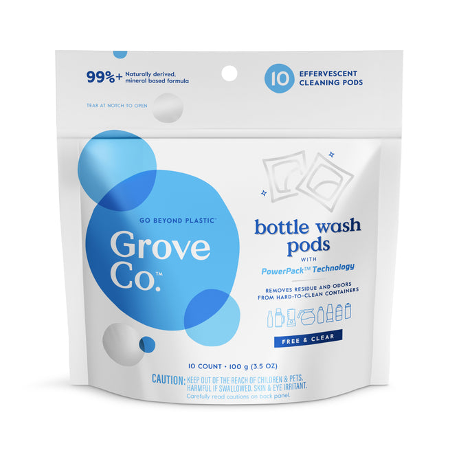 A white and blue Grove Co. Bottle Wash Pods pack contains 10 effervescent pods with PowerPak™ technology, made from 99% naturally derived, plant-based ingredients. The package warns to keep it out of reach of children and pets.