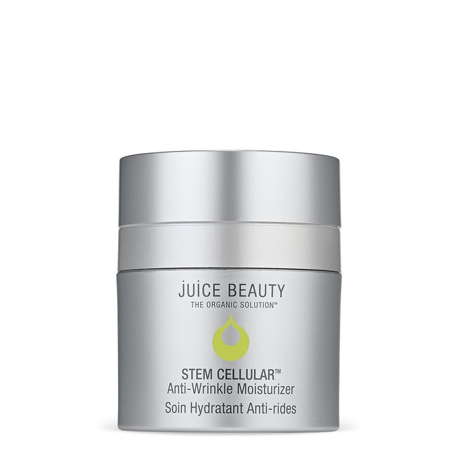 A container of Juice Beautys Stem Cellular Anti-Wrinkle Moisturizer elegantly rests against a white background. The sleek silver jar with green labeling prominently showcases: Juice Beauty, The Organic Solution, Soin Hydratant Anti-rides.
