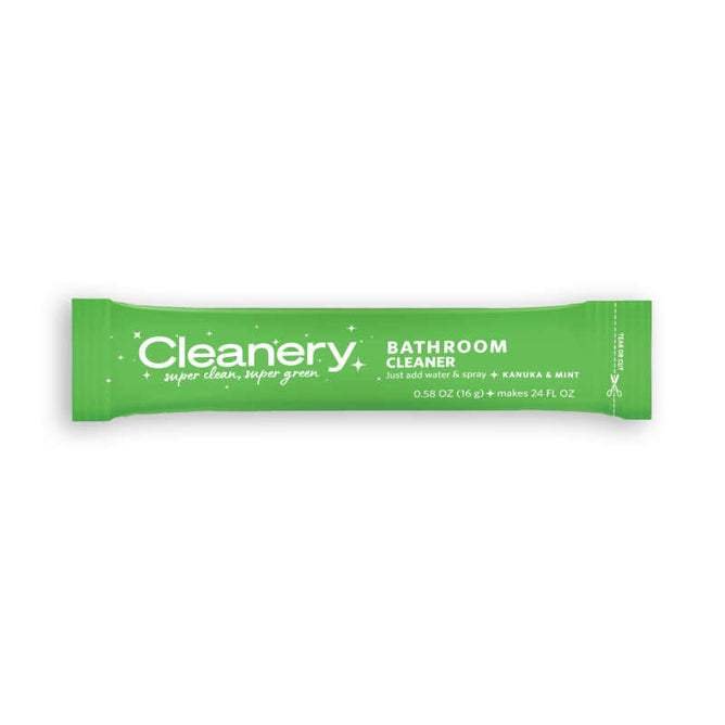 The green Cleanery Bathroom Cleaner Refill packet proclaims super clean, super green with its eco-friendly design. Featuring kanuka and mint scent, this refillable product weighs 0.58 oz (16g) and makes 24 fl oz. It has a rectangular design with white text on a lush green background.