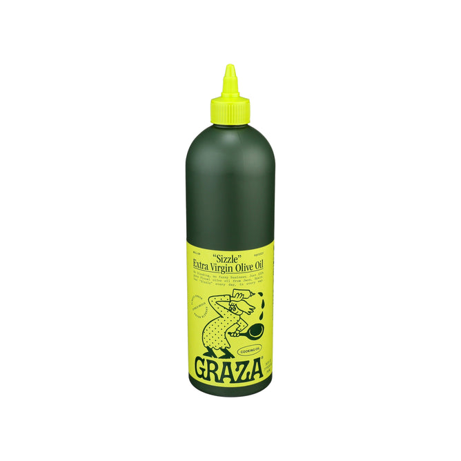 The green bottle of Grazas Sizzle Extra Virgin Olive Oil - For Cooking highlights a mellow flavor from mature olives and sports a bright yellow label featuring a cartoon chef pouring olive oil, with a pointed nozzle for easy dispensing.