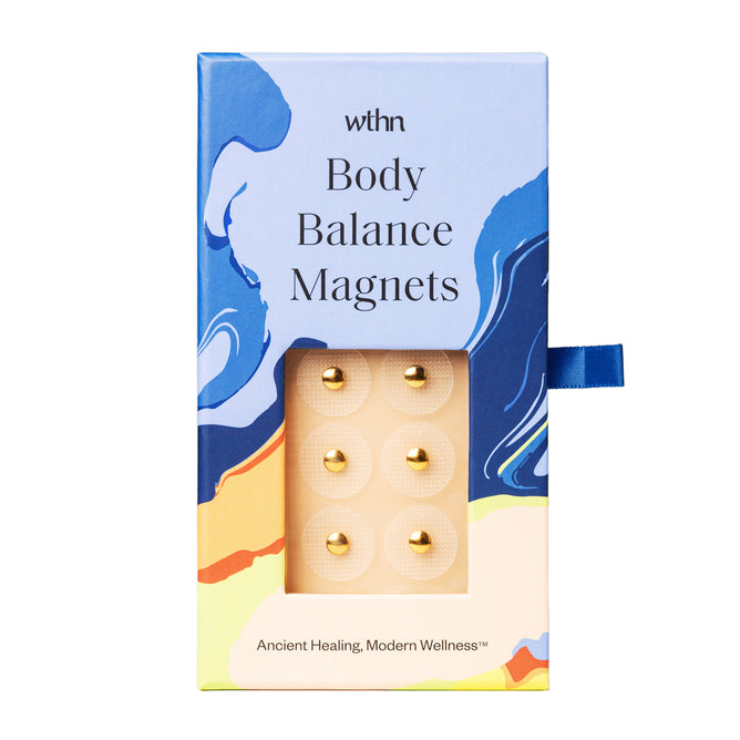 The WTHN Body Balance Magnets come in colorful packaging with a vibrant abstract design, featuring six gold magnets on adhesive patches. The tagline Ancient Healing, Modern Wellness encourages a journey toward stress reduction and harmony.