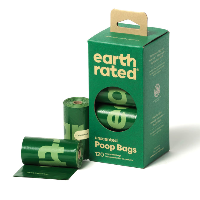 A green Earth Rated box contains 120 unscented, leak-proof Pet Waste Bags made from recycled plastic. Two rolls of the dark green refill bags are partially unrolled next to the box, which features a circular cutout revealing part of a roll inside.