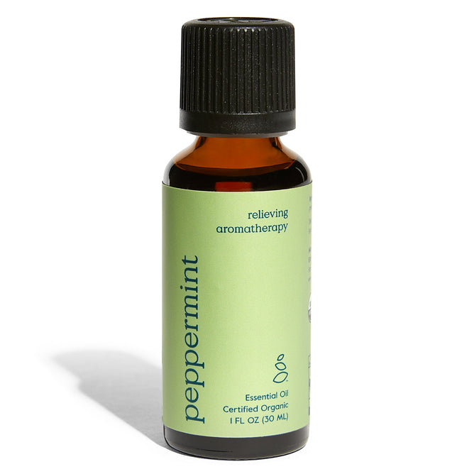 A small brown glass bottle from Grove Co. features a black cap and green label for Organic Peppermint Essential Oil - Relieving Aromatherapy. This certified organic 1 FL OZ (30 ML) bottle offers soothing home fragrance.