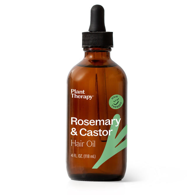 The 4 fl oz amber glass bottle with a black dropper cap, labeled Rosemary & Castor Hair Oil by Plant Therapy, promises to boost hair growth. Green leaves hint at its natural essence with rosemary essential oil and castor oil.