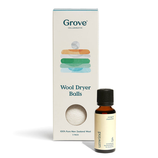 A Wool Dryer Balls + Unwind Essential Oil Blend box by Grove Co. displays three all-natural, hypoallergenic wool balls next to a small bottle labeled Unwind - Orange & Chamomile.