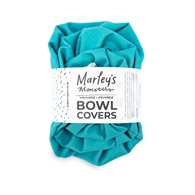 The Linen Bowl Cover Bundle - Aqua by Marleys Monsters offers a sustainable, reusable alternative for your kitchen. Its teal linen-like fabric cover crumples and fastens with an elastic loop, combining convenience with eco-friendly charm.