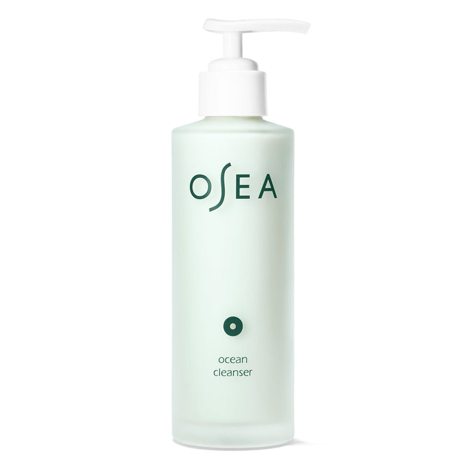 A frosted light green bottle with a white pump, labeled OSEA prominently, contains the seaweed-infused Ocean Cleanser gel. Its minimalistic design features clean lines and promises mineral-rich hydration in smaller text.