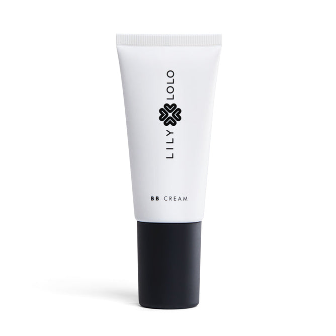 A white Lily Lolo Natural BB Cream tube features a black cap and logo, with LILY LOLO vertically and BB CREAM near the base, promising radiant skin.