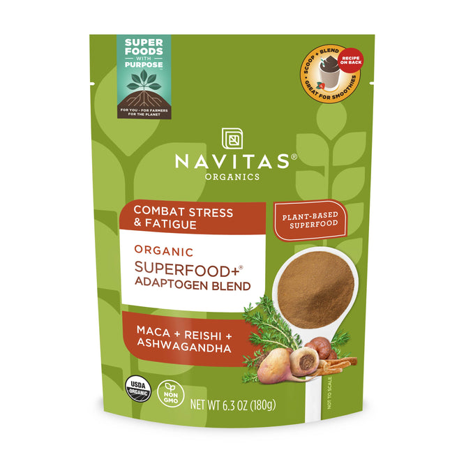 Navitas Organics Organic Adaptogen Blend, in a green packet adorned with maca, reishi, and ashwagandha images, features labels emphasizing its USDA organic and plant-based formula. This 6.3 oz (180g) blend helps combat stress and fatigue for a natural well-being boost.