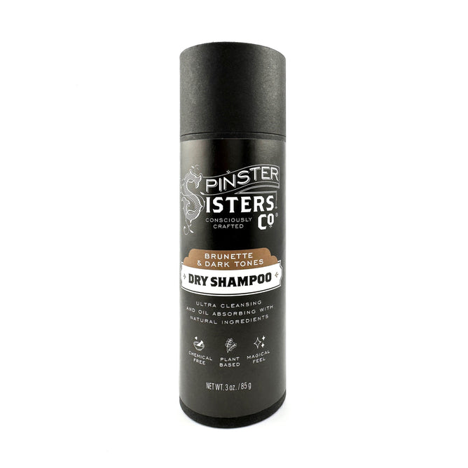 A 3 oz (85g) cylindrical black container of Spinster Sisters Co. Dry Shampoo for brunettes, enriched with deodorizing baking soda. It features natural ingredients and ultra-cleansing, oil-absorbing benefits.
