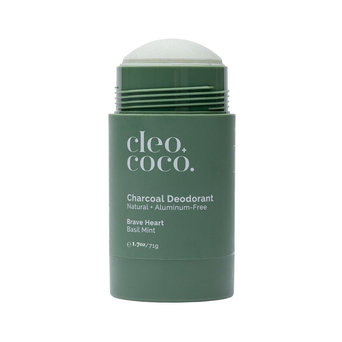 The Cleo & Coco Charcoal Extra Strength Deodorant in green, labeled Natural • Aluminum-Free, offers the Brave Heart Basil Mint scent. The open stick reveals a deodorant infused with essential oils for a refreshing experience.
