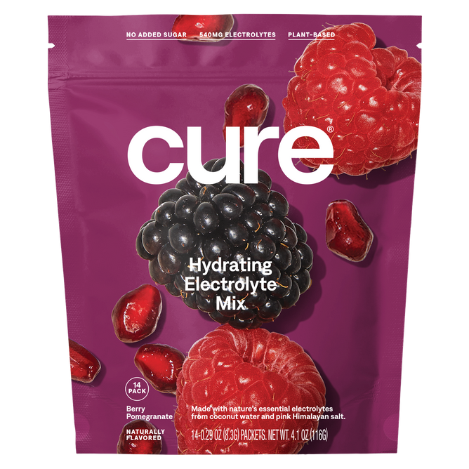 Cure Hydrations purple pouch of Hydrating Electrolyte Drink Mix features a berry pomegranate flavor with blackberries, raspberries, and pomegranate seeds on the package. Its plant-based with 540mg of electrolytes for quick absorption and contains no added sugar.