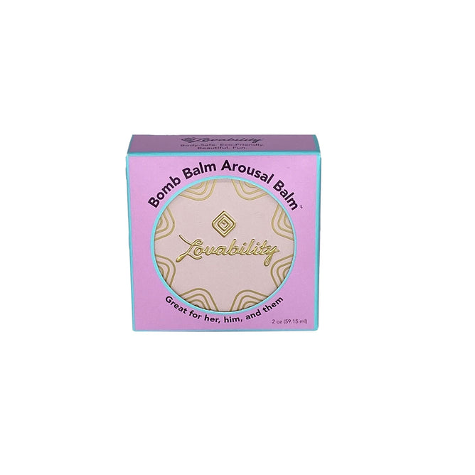 A 2 oz (59.15 ml) Bomb Balm Arousal Balm by Lovability, in a lavender and teal tin with decorative circles, is labeled as Great for her, him, and them and made with natural ingredients.