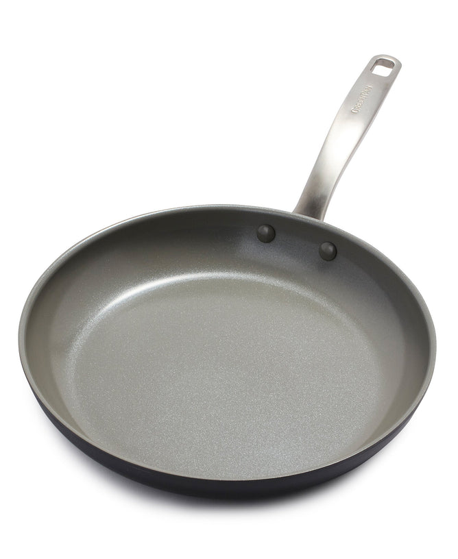 GreenPans Chatham 11 Nonstick Ceramic Fry Pan, PFAS-free, features a smooth gray nonstick coating and a shiny metal handle with two rivets. The handle has a hanging hole for easy display, elegantly showcased from above on a white background.
